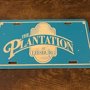 The Plantation Booster License Plate Community Resort Golf Course Leesburg Florida PLASTIC