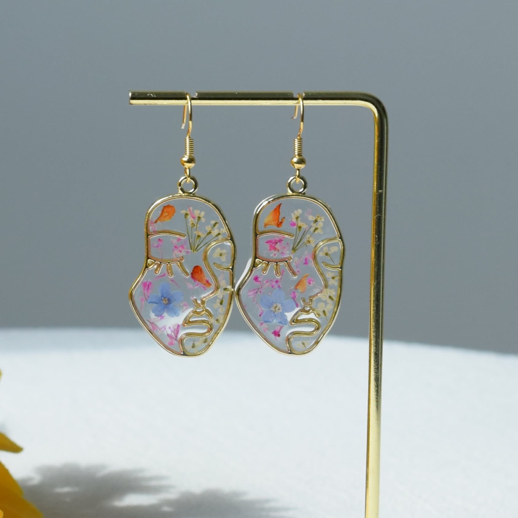 Face earrings original deals