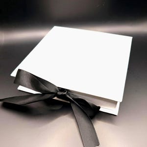 White Cardboard Jewelry Box with Flap Top and Black Ribbon Closure