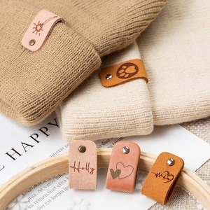80pcs Handmade Leather Labels for Crochet Items Personalized PU Leather Hat  Tags Embossed Crochet Tags with Holes Cute Patterns for Beanies Clothing