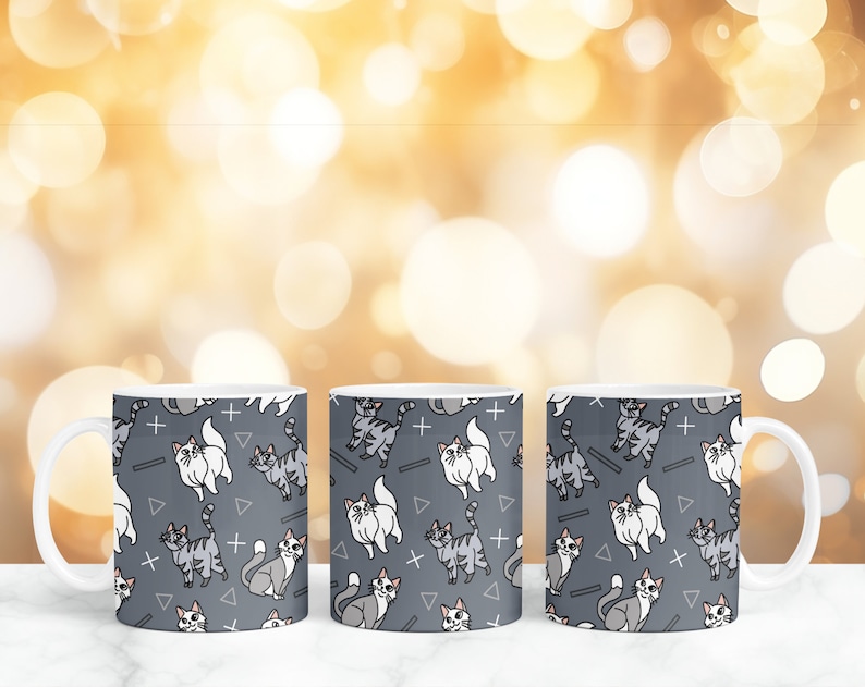 May include: Three white ceramic mugs with a gray background and a repeating pattern of gray and white cats, plus signs, and triangles.