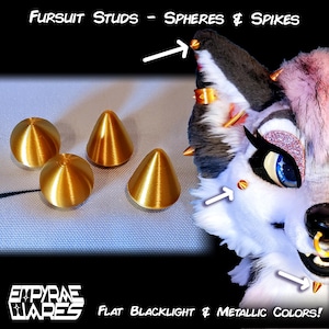 May include: Gold-colored spherical and conical studs for fursuits, labeled Fursuit Studs - Spheres & Spikes. The image shows four metallic studs and a fursuit head decorated with these studs, with text reading Empyrae Wares Flat Blacklight & Metallic Colors!