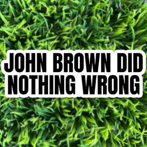 May include: A white sticker with black text on a green background. The text reads "JOHN BROWN DID NOTHING WRONG".