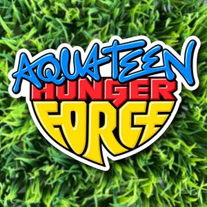 May include: A die-cut sticker featuring the Aqua Teen Hunger Force logo. The text Aqua Teen is in blue, Hunger is in red, and Force is in yellow. The design has a white border and a stylized, bold font, presenting a vibrant graphic representation.