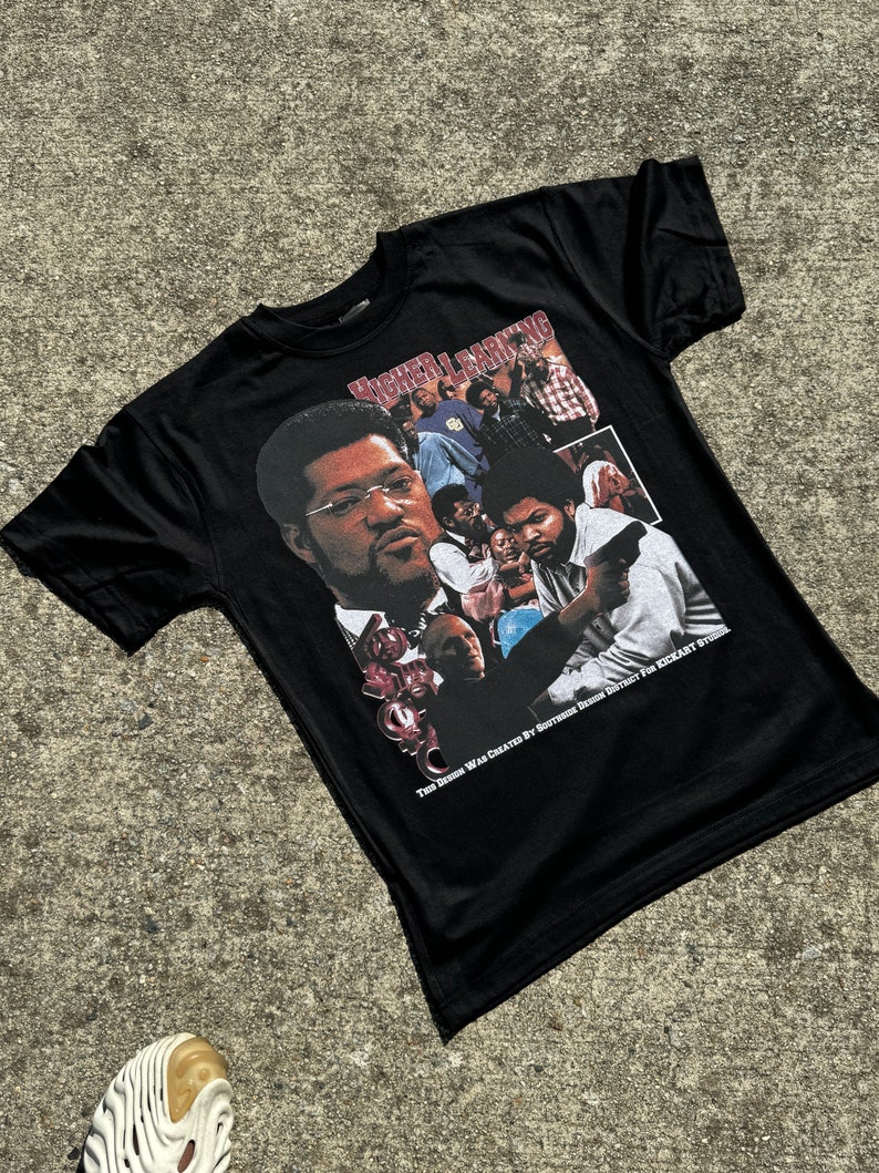 May include: Black t-shirt featuring a graphic from the movie "Higher Learning." The design includes images of several actors and the text "Higher Learning." The shirt also has the text "THIS DESIGN WAS CREATED BY SOUTHSIDE DESIGN DISTRICT FOR KICKART STUDIO."
