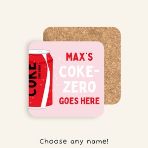 May include: Pink coaster with a red and white can of Coke Zero and the text "MAX'S COKE-ZERO GOES HERE".