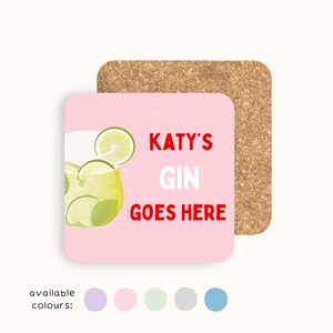 May include: A square pink coaster with the text "KATY'S GIN GOES HERE" in red. The coaster features a lime and mint cocktail illustration. A cork coaster is behind it. Available colors are shown below.