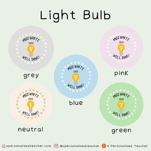 May include: Four round stickers with a light bulb graphic and the text "Miss White Says Well Done!" in a circle of stars. The stickers are in the colors grey, pink, blue, and green.