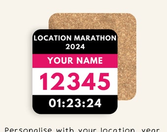 May include: A black and white square coaster with a pink and white marathon race bib. The coaster has the text "LOCATION MARATHON 2024" at the top, "YOUR NAME" in the middle, and "12345" and "01:23:24" below.