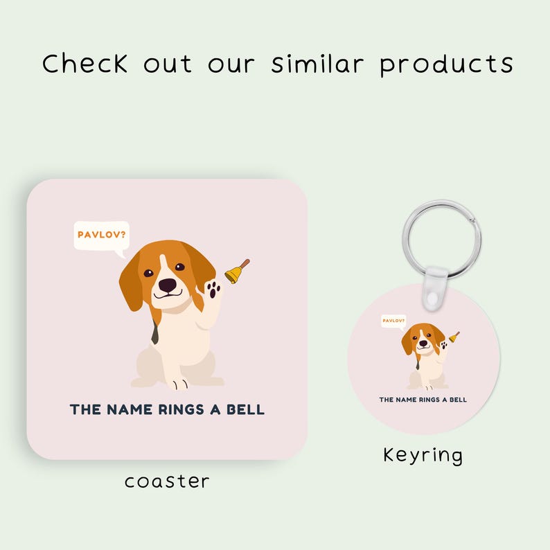 May include: A pink coaster and a round keyring featuring a cartoon beagle dog with a bell. The text "PAVLOV?" is in a speech bubble above the dog. The text "THE NAME RINGS A BELL" is below the dog. The coaster says "coaster" and the keyring says "Keyring".