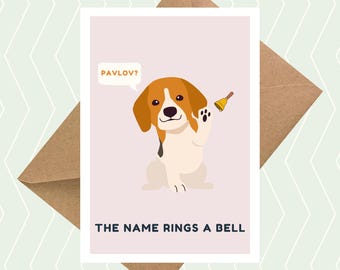 May include: A greeting card with a cartoon beagle dog holding a bell. The card has the text "Pavlov?" in a speech bubble above the dog and "The name rings a bell" below the dog.