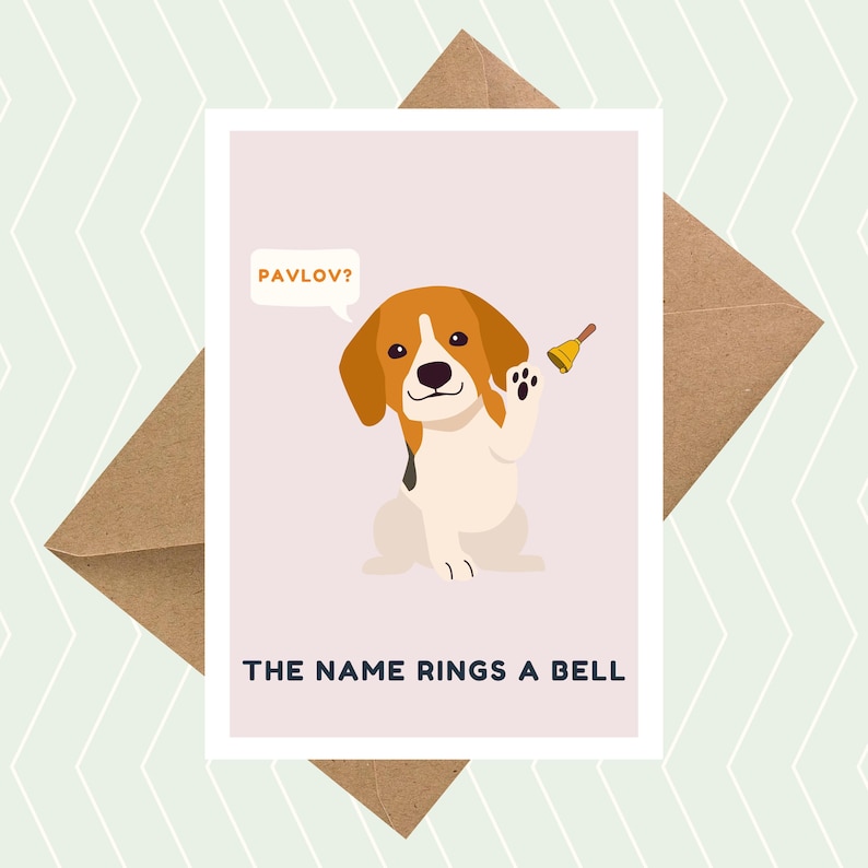 May include: A greeting card featuring a cartoon beagle dog holding a bell. The card has the text "Pavlov?" in a speech bubble above the dog and "The name rings a bell" below the dog.