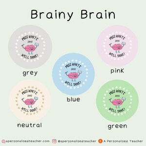 May include: Four round stickers with a cartoon brain holding a pencil and a book. The stickers are in the colors grey, blue, pink, and green. Each sticker says "Miss White Says Well Done!"
