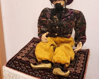 Marioneta sobre alfombra voladora