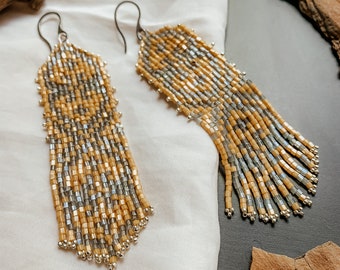 Earrings "Ancient ornament" with beige fringes in Japanese beads for women bohemian style