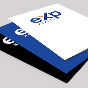May include: Three stacked sheets of paper in white, blue, and black. The top sheet is white with the blue and orange "eXp REALTY" logo. The blue sheet has the "eXp REALTY" logo in white. The bottom sheet is black.