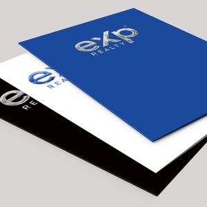 May include: Three stacked folders with the eXp Realty logo in silver on a blue folder, silver on a white folder, and blue on a black folder.