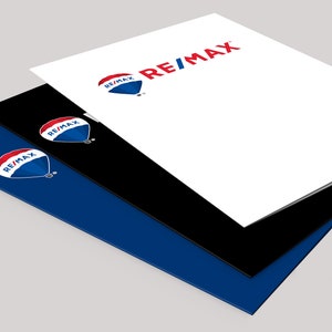 May include: Three stacked folders with the RE/MAX logo and a hot air balloon graphic. The top folder is white, the middle folder is black, and the bottom folder is blue.