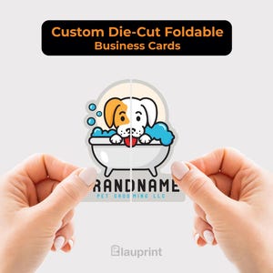 May include: Custom die-cut foldable business cards. The card features a cartoon dog in a bathtub with bubbles. The dog has brown and white fur and a red tongue. The business card is being held by two hands.