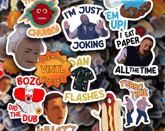 May include: A collection of colorful stickers featuring various phrases and images, including "That's a Chunky", "I'm Just Joking", "Slop 'Em Up! I Eat Paper All The Time", "Bozo Did The Dub", "Dan Flashes", "Turbo Time", and "What?"