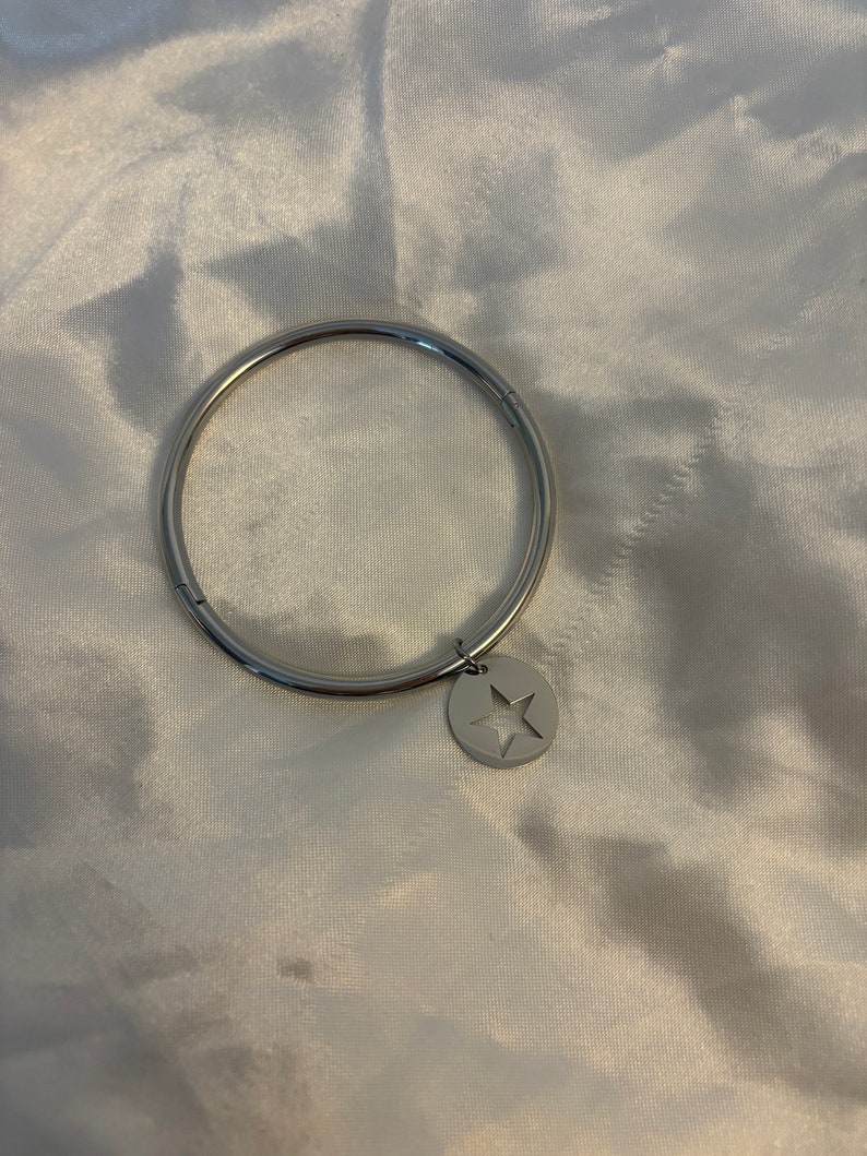 Silver hollowed out star bangle image 2