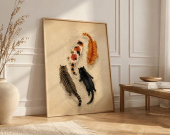 May include: A framed rectangular wall art print featuring four cats viewed from above, positioned in a circle on a light beige background. The cats include a calico, an orange tabby, a brown tabby, and a solid black cat, all facing inward.