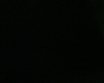 May include: A black background with a subtle grainy texture.