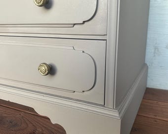 beige dresser with gold handles CREAM LACQUERED DRESSER WITH BRASS ACCENTS