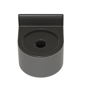May include: A dark gray, cylindrical object with a central hole and a rectangular top. The object has a smooth, matte finish and appears to be made of a solid material. The design is simple and functional.