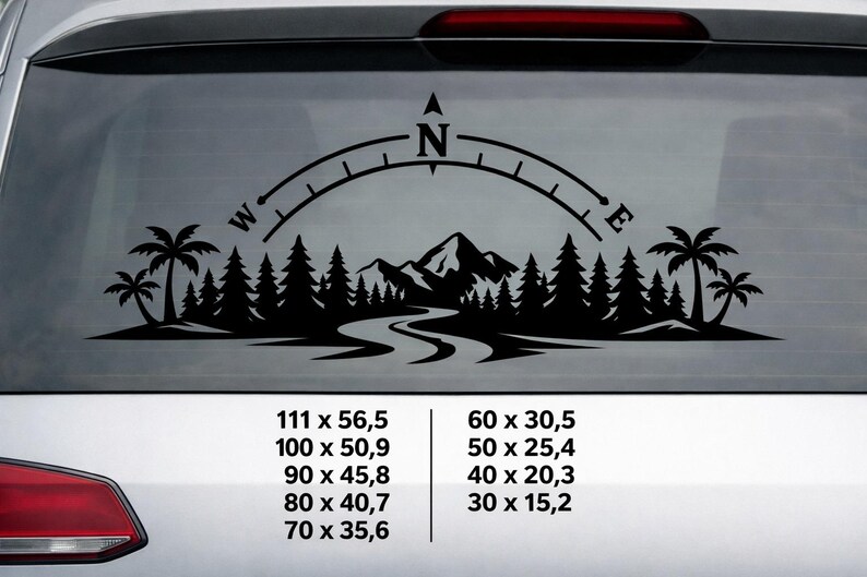 May include: A black vinyl decal featuring a compass rose arching over a landscape of pine trees, palm trees, and mountains with a winding river. The text displays various dimensions in centimetres: 111 x 56.5, 100 x 50.9, 90 x 45.8, 80 x 40.7, 70 x 35.6, 60 x 30.5, 50 x 25.4, 40 x 20.3, and 30 x 15.2.