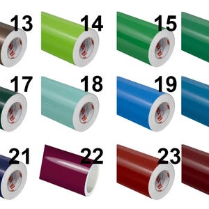 May include: A grid of twelve rolls of adhesive vinyl in various colours, each labelled with a number from 13 to 24. The colours include brown, lime green, green, dark green, forest green, light blue, blue, teal, navy, magenta, red, and dark red.