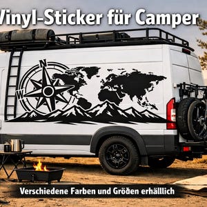 May include: A white camper van featuring a large black vinyl decal on its side, displaying a compass rose, a world map, and a mountain range silhouette. The text "Vinyl-Sticker für Camper" and "Verschiedene Farben und Größen erhälllich" is visible.
