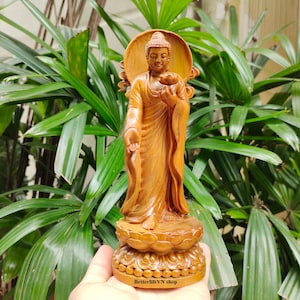 Handcrafted Gautama Buddha standing on a Lotus pedestal, holding a lotus flower, Wooden Shakyamuni Buddha statue, Buddha Gift, Home decor