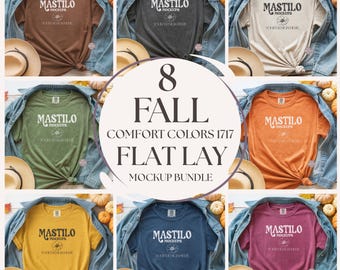 May include: A flat lay mockup bundle featuring eight different colored t-shirts. Each shirt is displayed with a denim jacket, a straw hat, and fall-themed decorations. The shirts are in various colors, including brown, gray, beige, green, orange, yellow, blue, and burgundy.