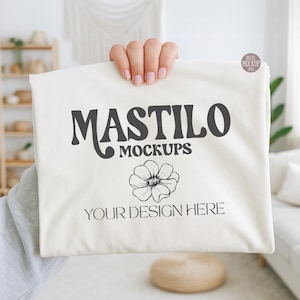 Hand-held Comfort Colors 1717 Ivory t-shirt mockup in a bright boho room, ideal for showcasing POD designs and Etsy shop graphics.
Soft pastel lifestyle mockup featuring the trendy hand-held style, perfect for creators and small businesses using feminine or girly designs.