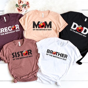 May include: Five t-shirts in various colors, each with a different family member's name and the phrase "of the birthday boy." The designs include the character Elmo.