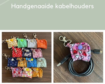 Handgenaaide kabelhouders