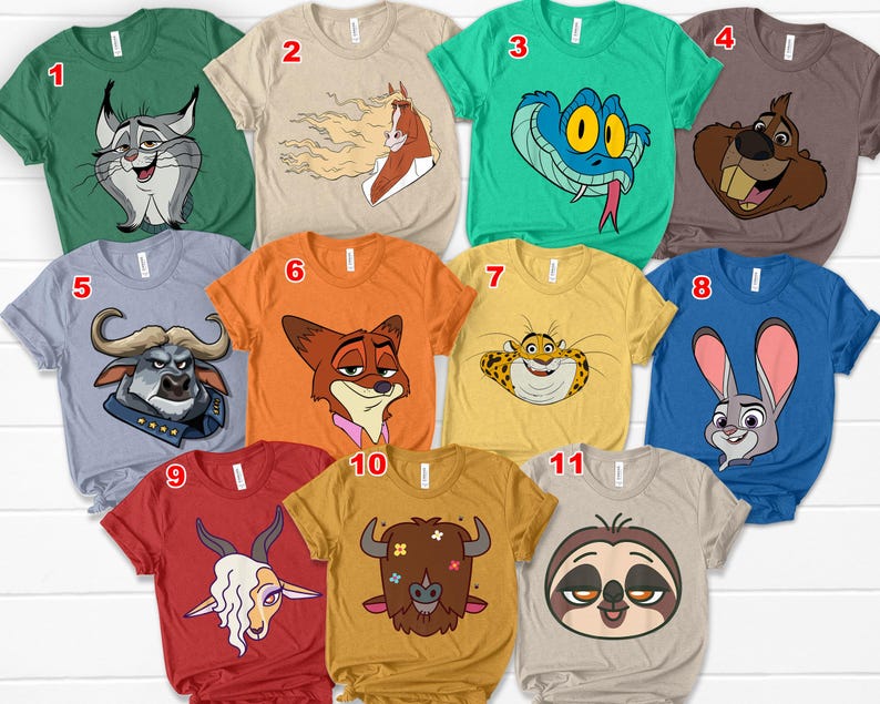 May include: A collection of eleven short-sleeved t-shirts in various colors, each featuring a cartoon animal graphic. The shirts are in shades of green, tan, blue, orange, and yellow, with designs including a snake, a rabbit, and a sloth.