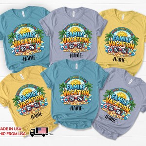 May include: Six short-sleeved t-shirts in blue, light purple, and yellow featuring a graphic of a beach scene with palm trees, a sun, sunglasses, and the text "FAMILY VACATION" and "MAKING MEMORIES TOGETHER" with "20 26" and a placeholder for a name.