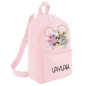 May include: Pink backpack featuring a Mickey Mouse design with the name "LAYLAH" printed on the front.