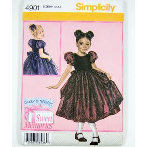 May include: A Simplicity 4901 sewing pattern envelope for a child's dress. The package features a pink background with illustrations of a dark dress with puff sleeves and a full skirt. Text includes Simplicity, 4901, size HH 3,4,5,6, and Daisy Kingdom Sweet Memories.