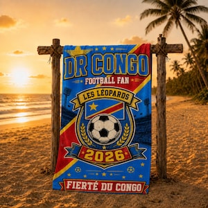 May include: A rectangular beach towel featuring a blue, yellow, and red design with the text DR CONGO FOOTBALL FAN, LES LÉOPARDS, and 2026. The center displays a soccer ball graphic, the national flag of the DRC, and FIERTÉ DU CONGO at the bottom.