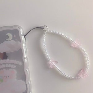 Phone charm wrist strap