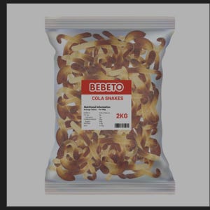 May include: A clear plastic bag filled with brown and beige cola-flavoured gummy snakes. The central label features the red Bebeto logo, the text Cola Snakes, nutritional information, and a weight of 2kg. The packaging is transparent, showing the sweets.