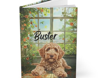 May include: A brown and white dog named "Buster" is lying down in front of a window with a green leafy vine. The dog is looking at the camera. The window is open and there is a view of a garden outside.