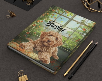 May include: A brown and white dog named "Buster" is lying on a wooden surface with a window behind it. The window has a view of a garden with green plants and flowers. The dog is looking at the camera. The surface is covered in small, brown leaves.