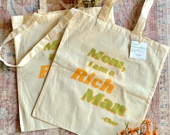 Mom, I am a Rich Man Cher quote tote bag