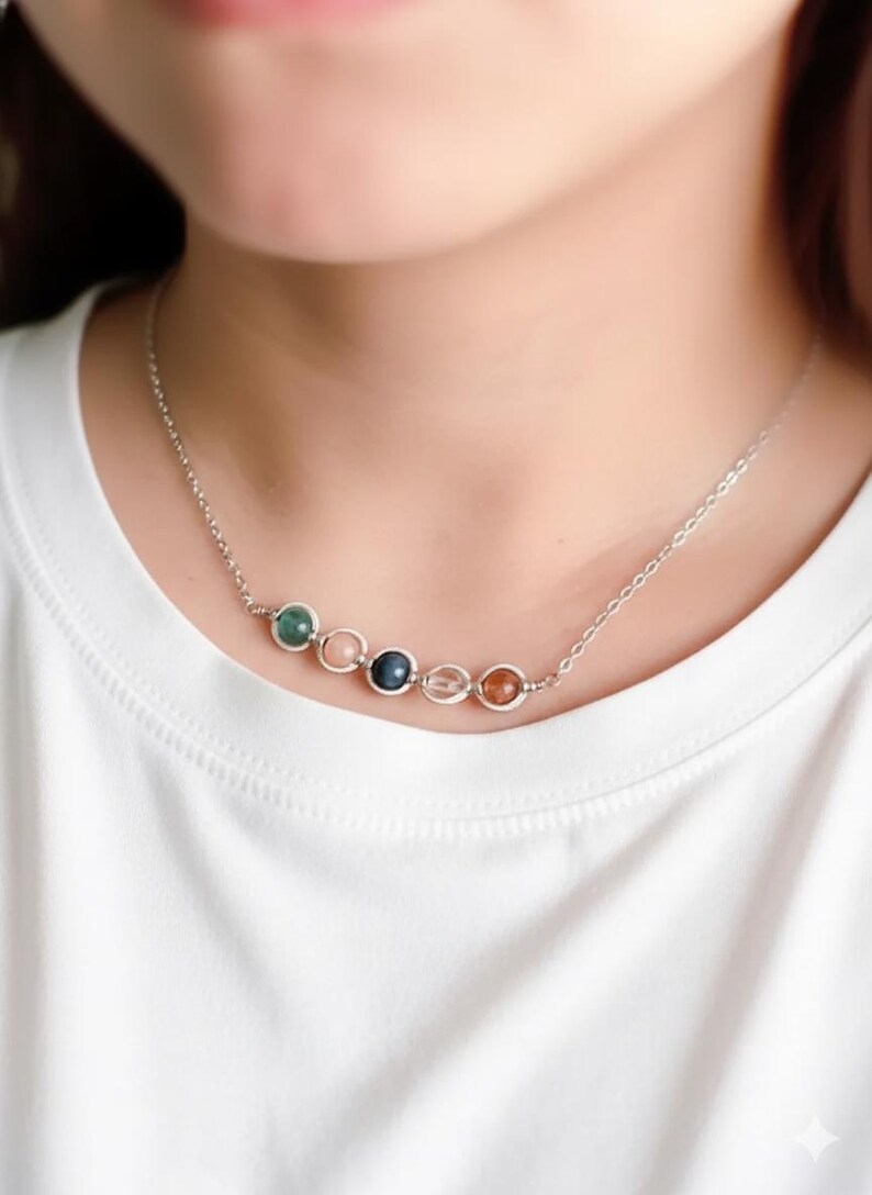 Model wearing a dainty Sagittarius birthstone necklace. Elegant layered jewelry style, unique handmade spiritual gift for her, ships from USA.