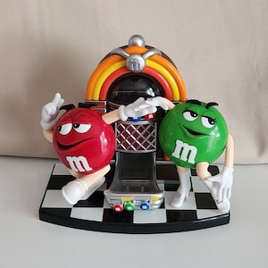 Dispensador de caramelos M&M con Jukebox danzante