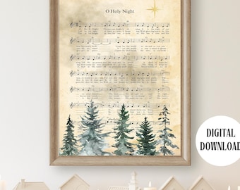 May include: A framed print featuring the sheet music for "O Holy Night", with a watercolour forest at the base. The print has a vintage style and is set in a light brown wooden frame. A digital download is available.
